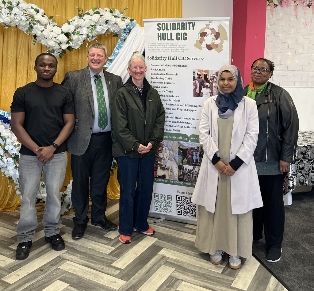 A group of people form Solidarity Hull with the High Sheriff of East Riding