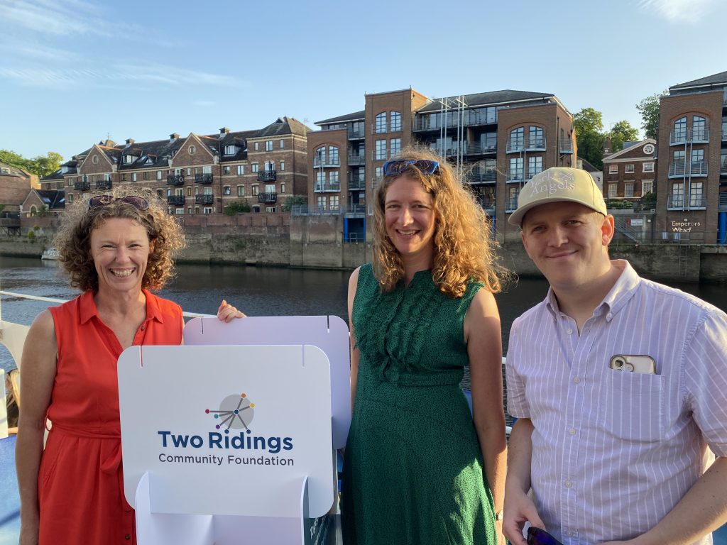 3 people on a boat cruise with York Angels